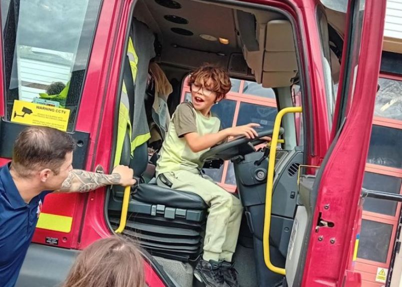 A young carer on a respite trip to visit Fire station