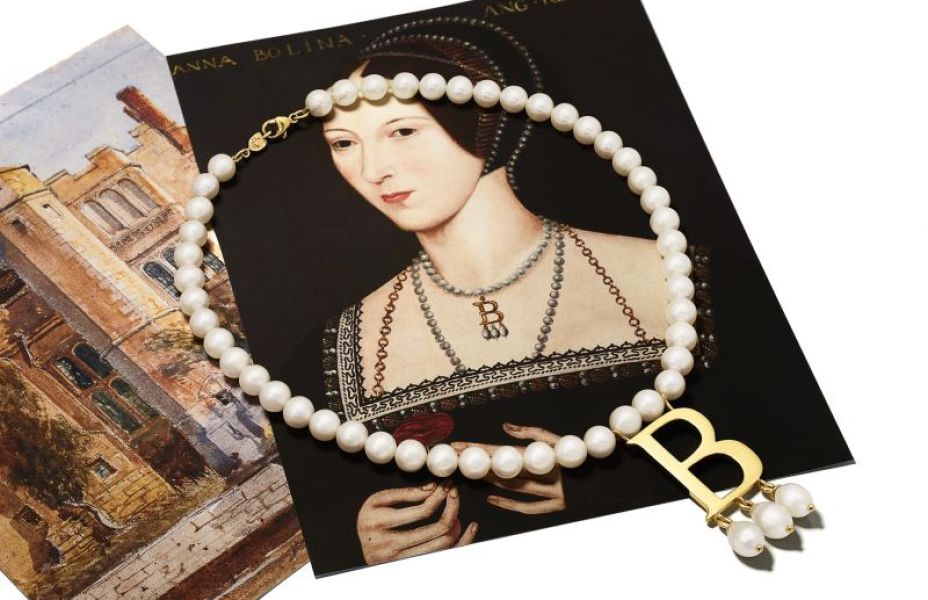 Iconic 'B' necklace on top of pictures of Anne Boleyn and Hever Castle.