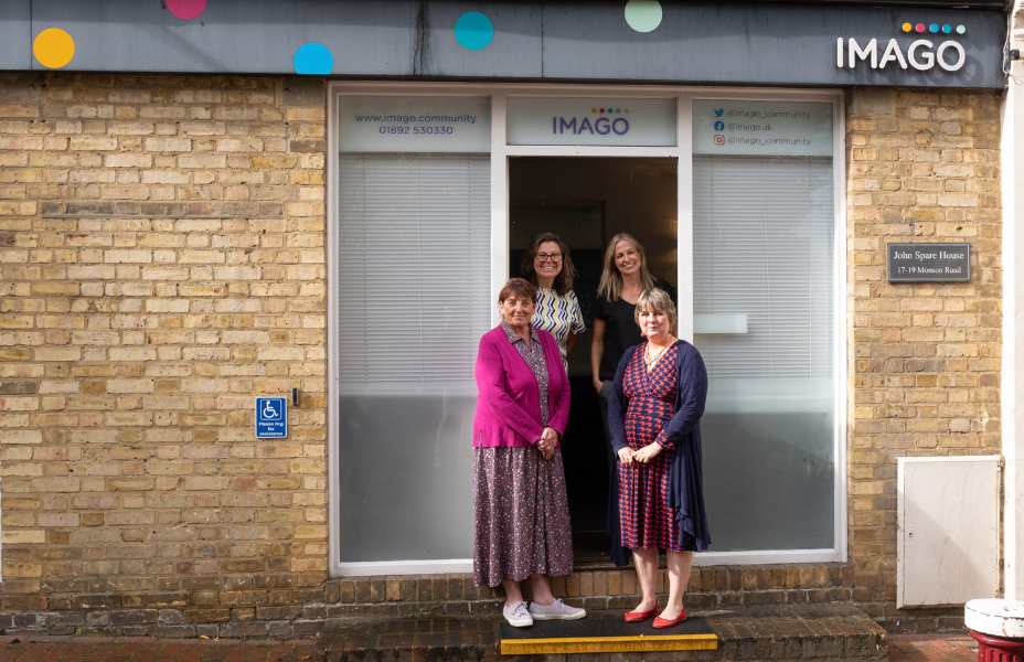 Caroline, Liz, and Louise from Imago with Angela from Cancer Pickering Centre standing outside Imago's building in Tunbridge Wells