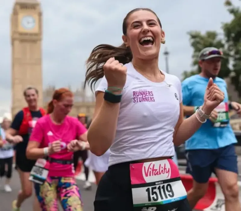 Woman running in London with Big Ben in the background