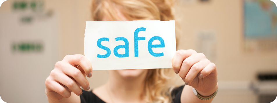 Safe Photograph - girl holding up a sign that says Safe